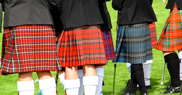 The tartan skirt is typical of Scotland.
